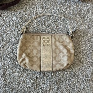 Gold COACH wristlet